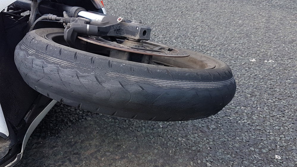 badly worn motorcycle tyre